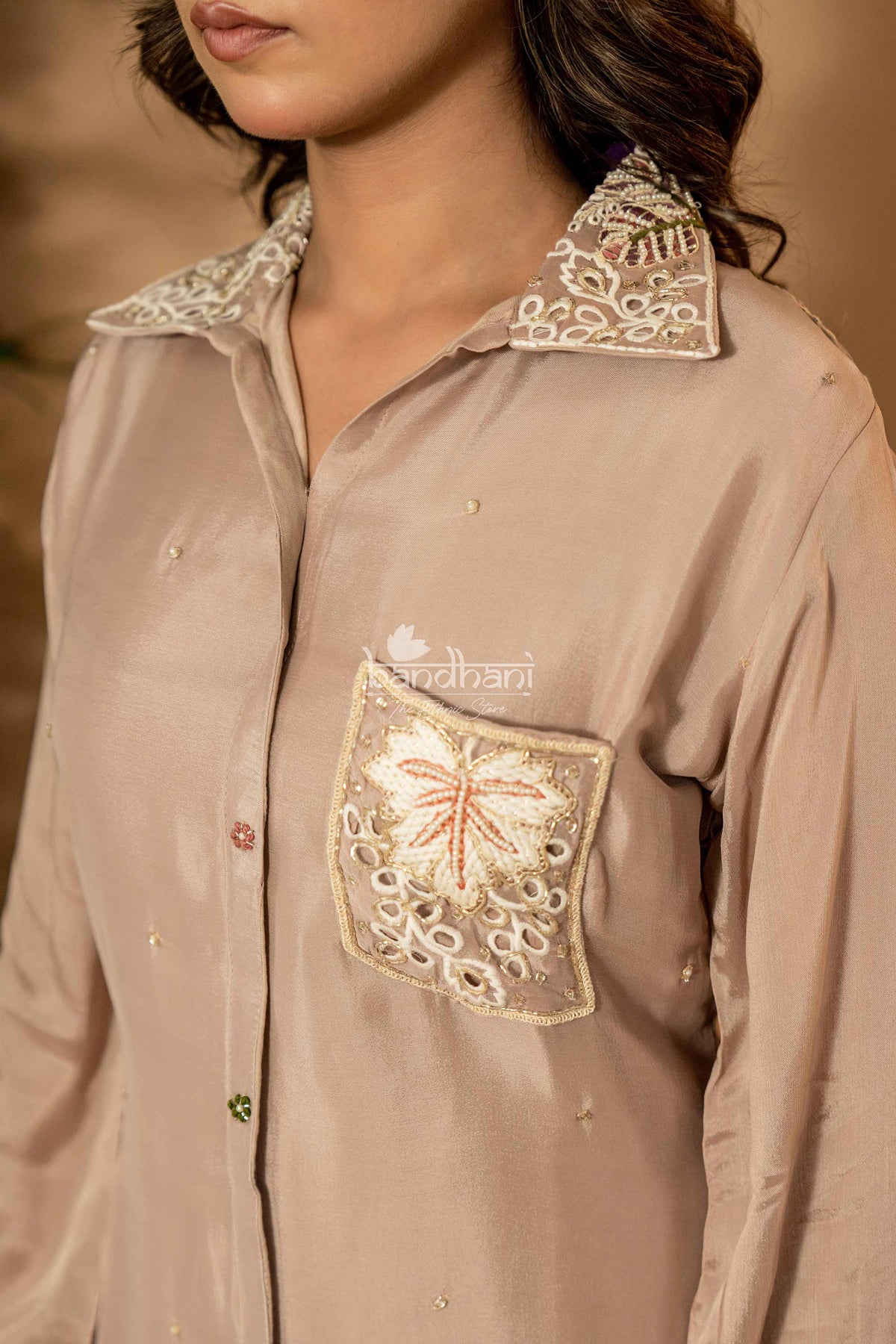 Brown shirt with intricate white embroidery on collar and pocket, brand 'Bharath' visible.