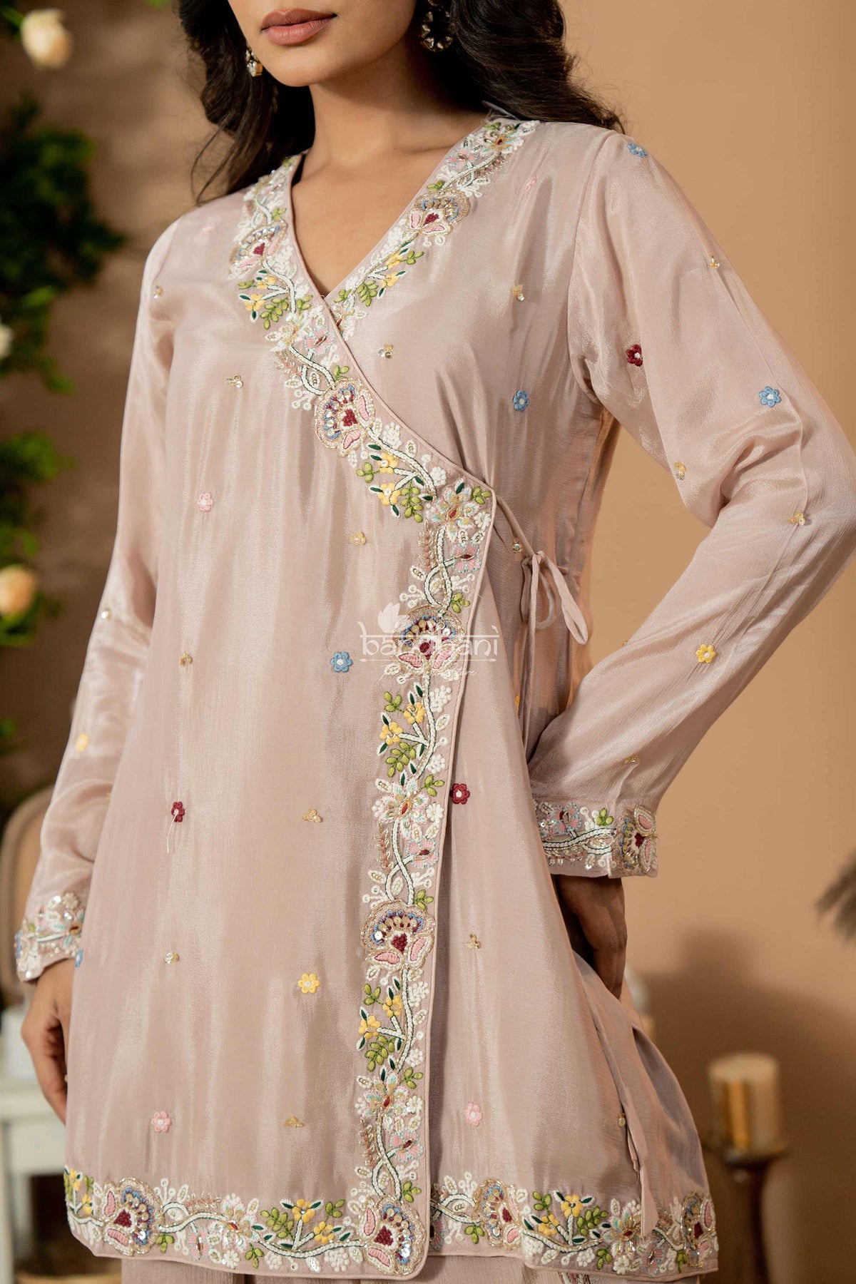 Light pink embroidered dress with a blurred background