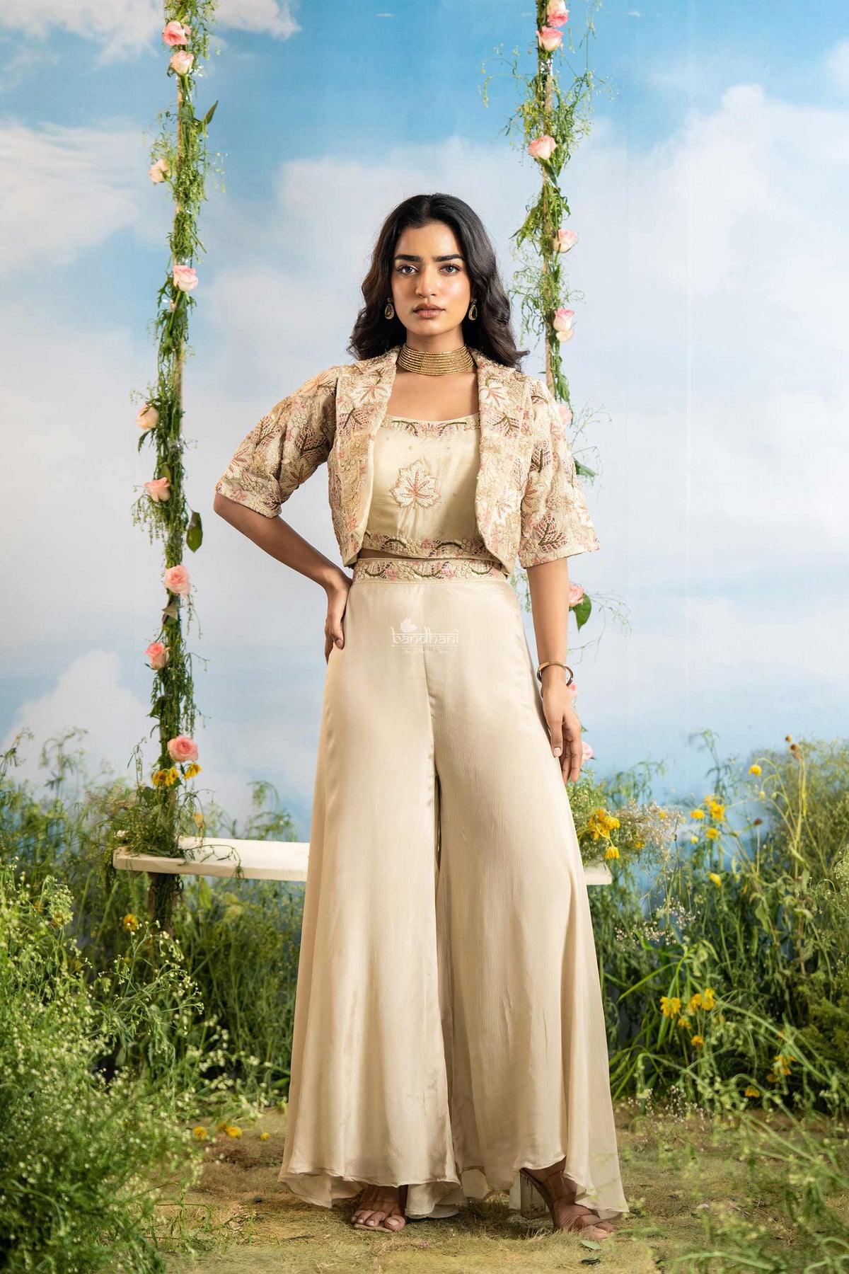 Woman in a beige outfit sitting on a swing in a natural setting