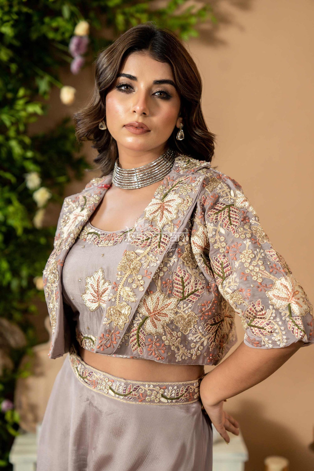 Woman wearing a floral blouse with a beige background