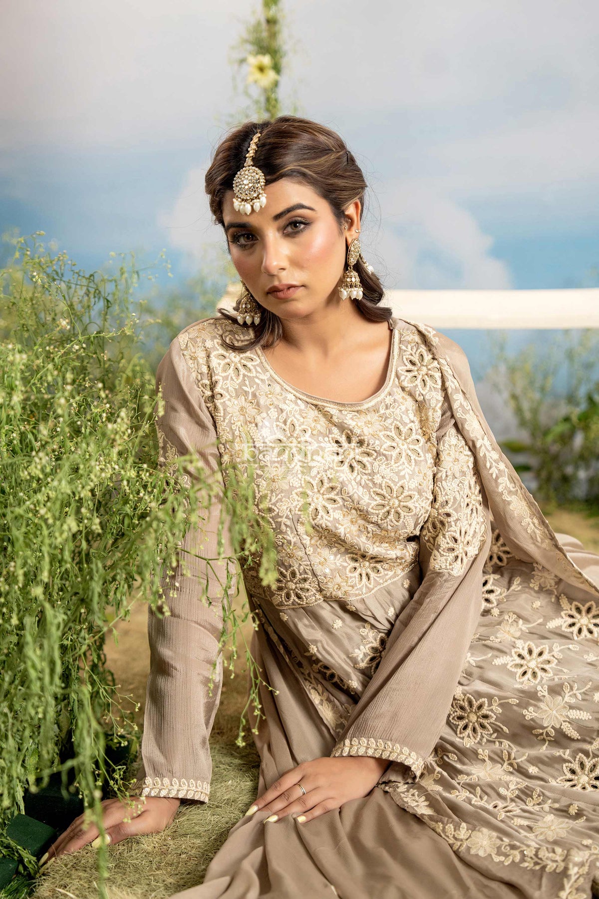 Woman in traditional embroidered outfit with floral background