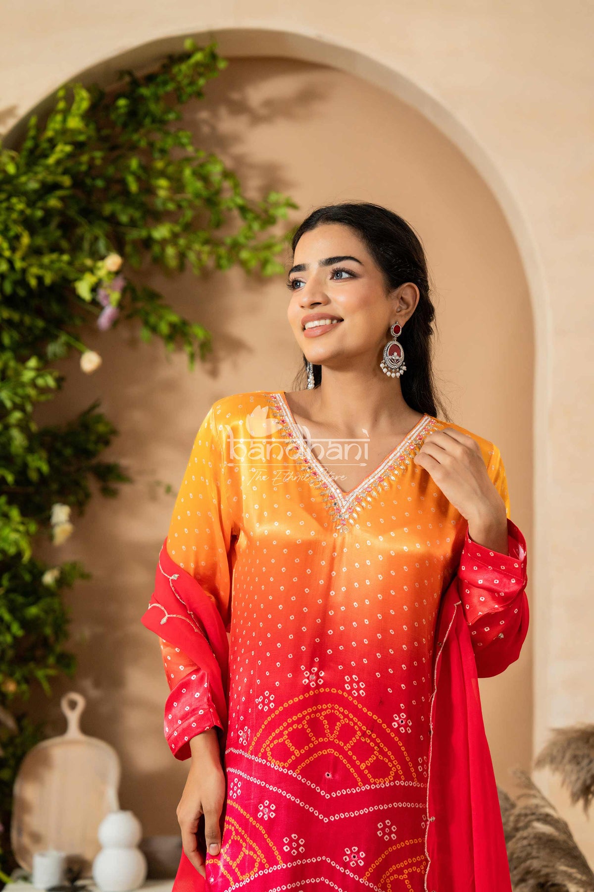 Woman wearing a colorful traditional outfit with a blurred background