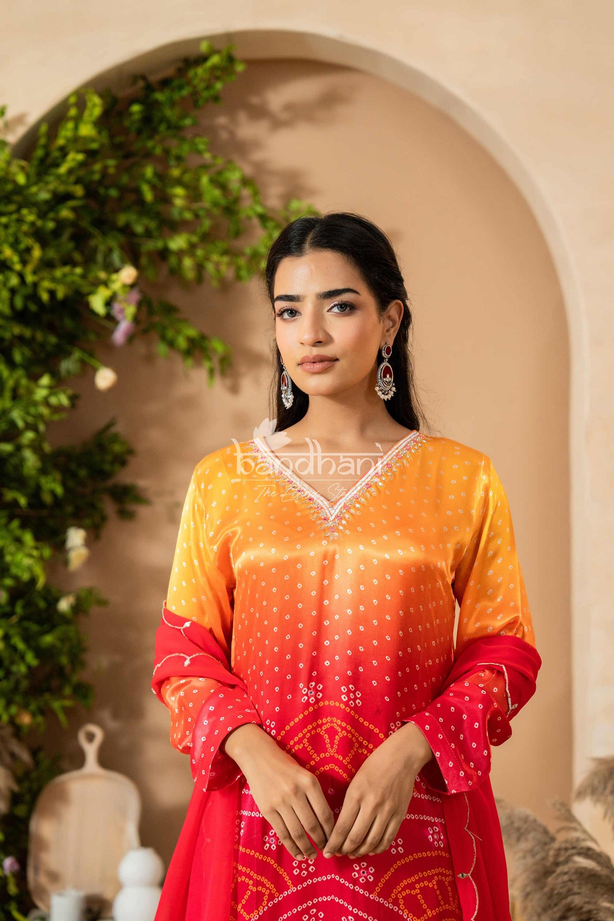 Woman wearing a colorful traditional outfit with a blurred background