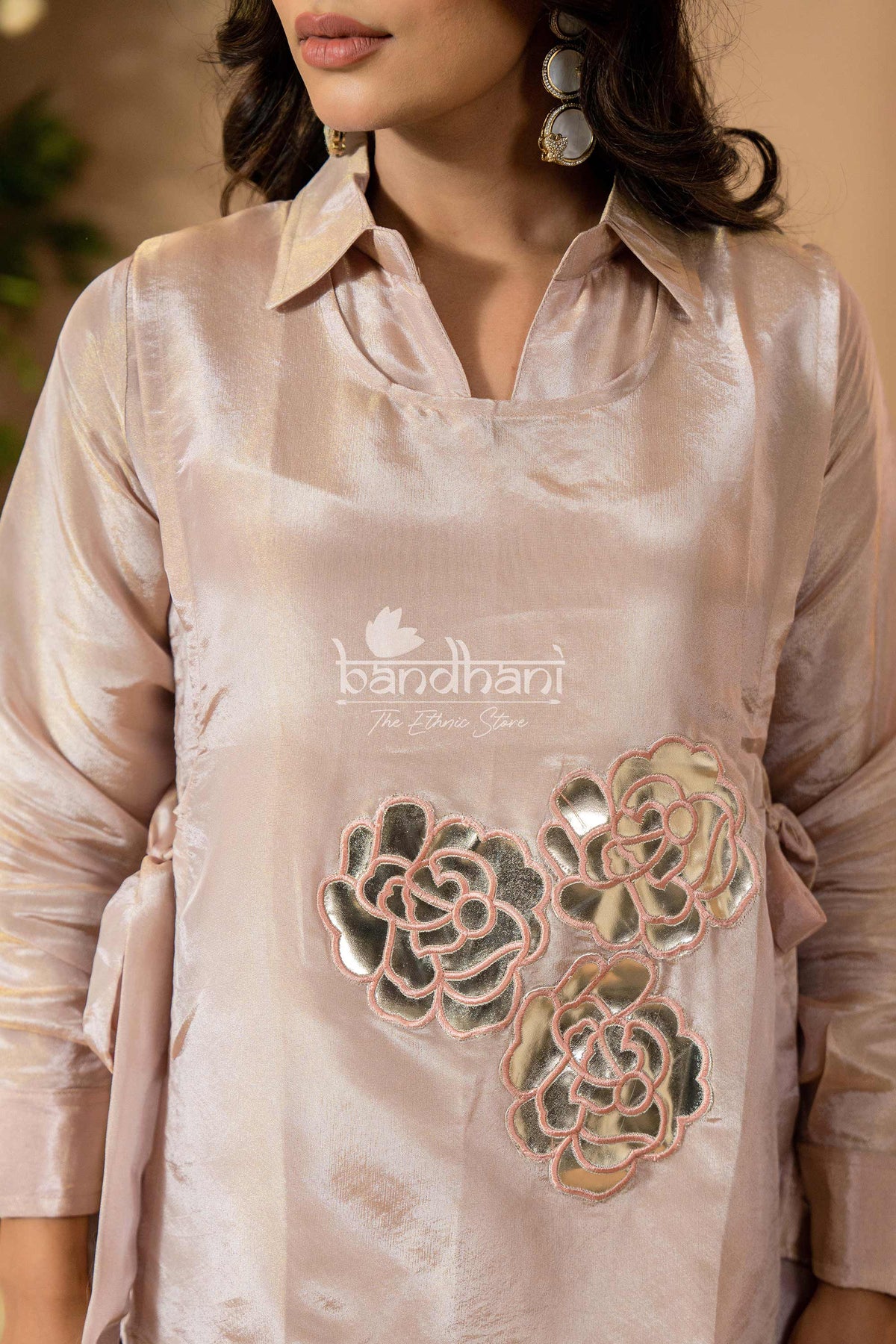 Light pink blouse with floral embroidery and 'Bendhani' branding.